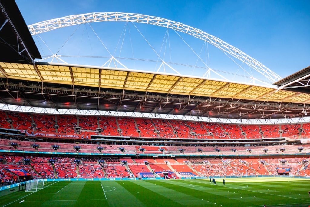 pexels-photo-10864081 Stunning view of Wembley Stadium, England's iconic football venue, under clear blue skies.